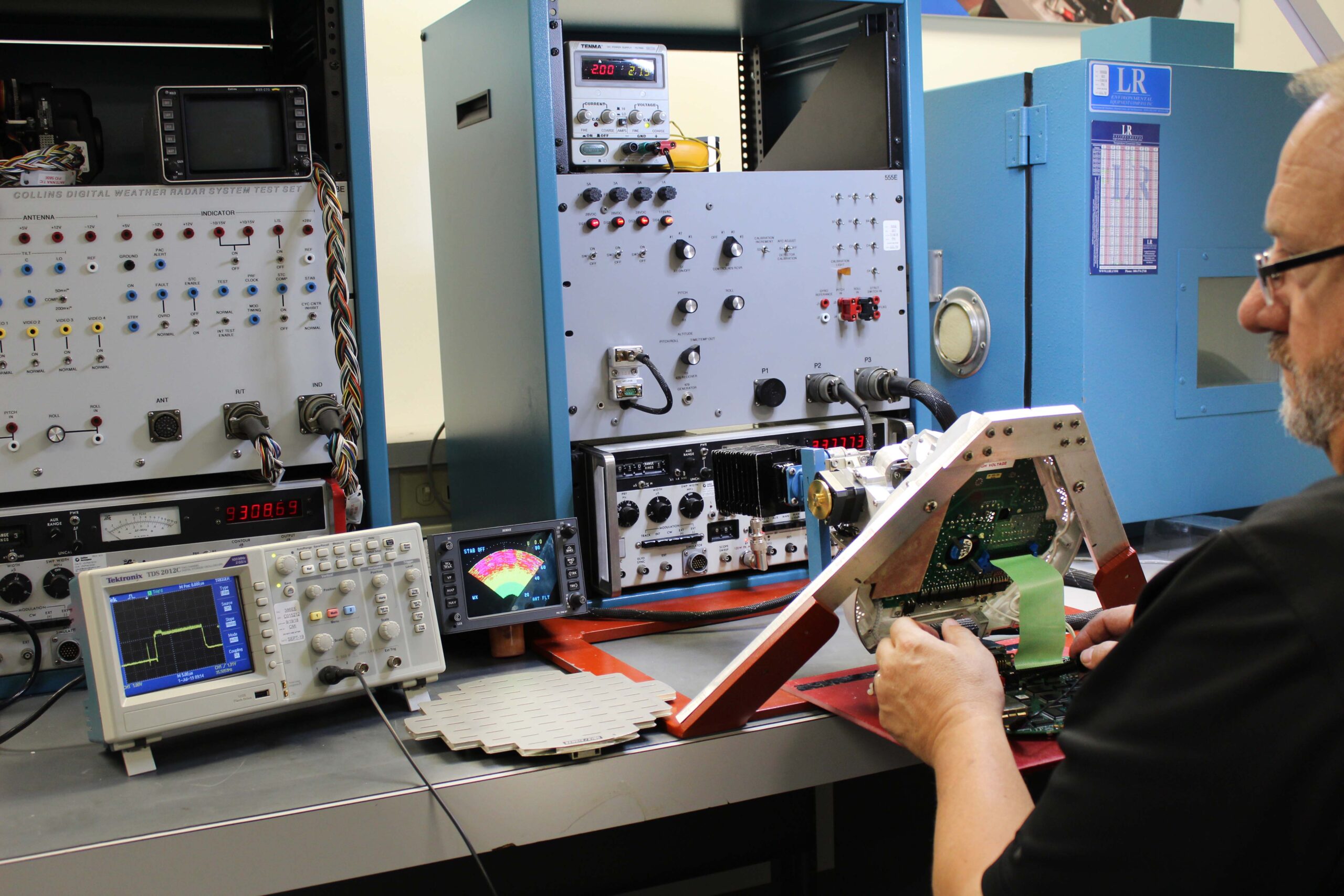 Avionics test bench with a weather radar test set and oscilloscope