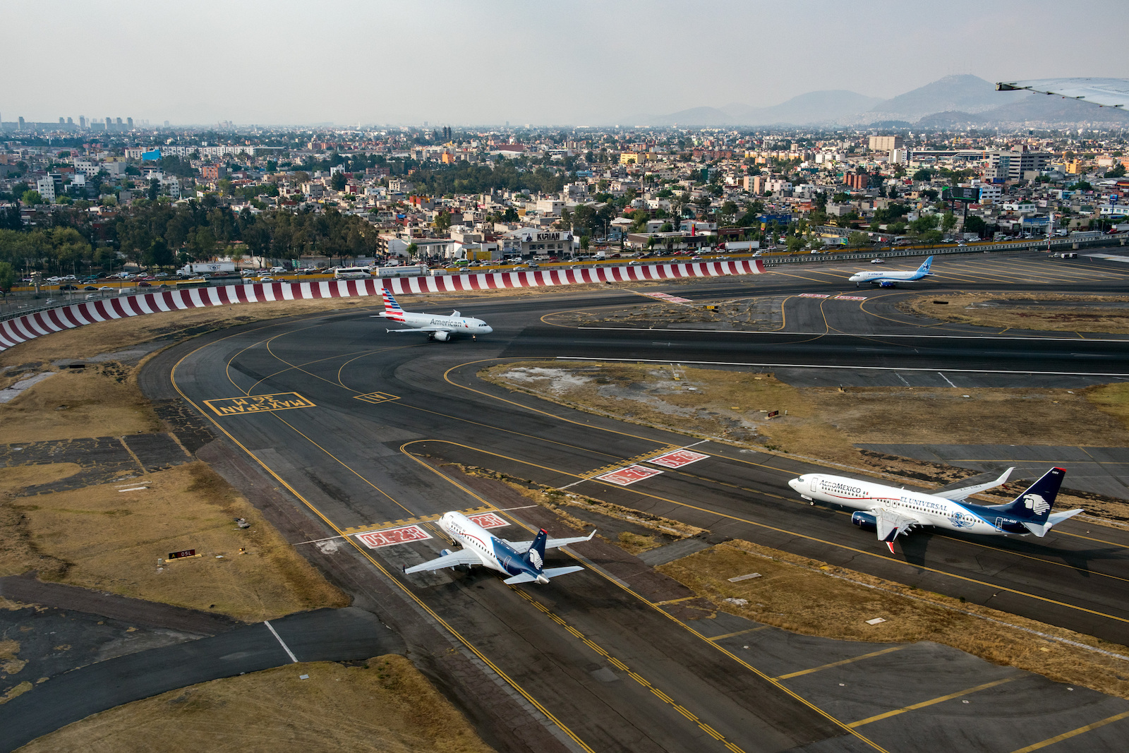 Real photo: Aeromexico and American Airlines aircraft taxiing at Mexico City International Airport